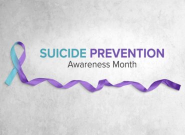 A banner that reads "Suicide Prevention Awareness Month"